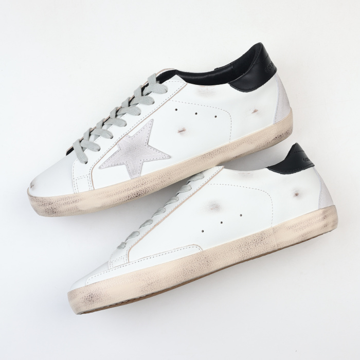 Golden G00se Super-Star trainers with black heels tab and metal stud lettering