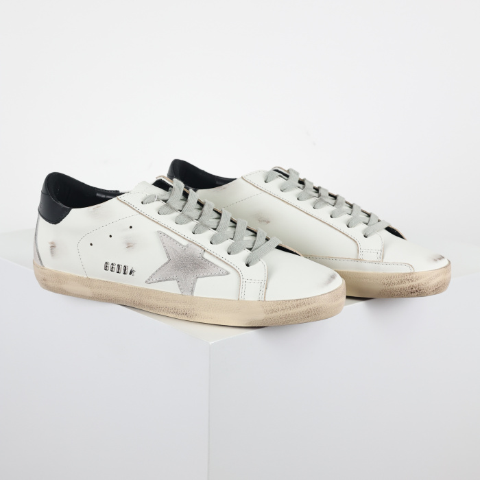 Golden G00se Super-Star trainers with black heels tab and metal stud lettering