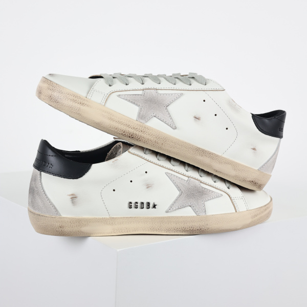 Golden G00se Super-Star trainers with black heels tab and metal stud lettering