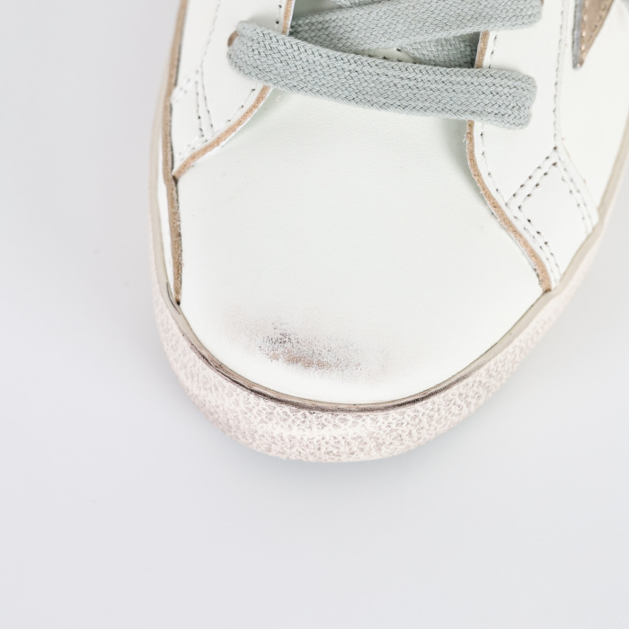 Golden G00se Super-Star trainers with gold star and black glitter heels tab