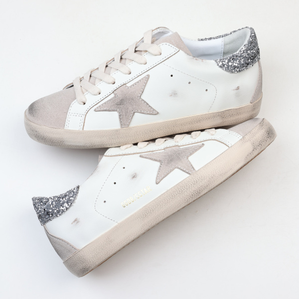 Golden G00se Super-Star trainers with gray star and silver glitter heels tab