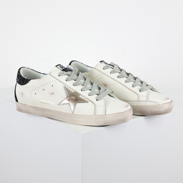 Golden G00se Super-Star trainers with gold star and black glitter heels tab