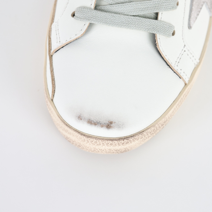 Golden G00se Super-Star trainers with black heels tab and metal stud lettering