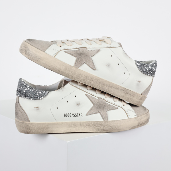 Golden G00se Super-Star trainers with gray star and silver glitter heels tab