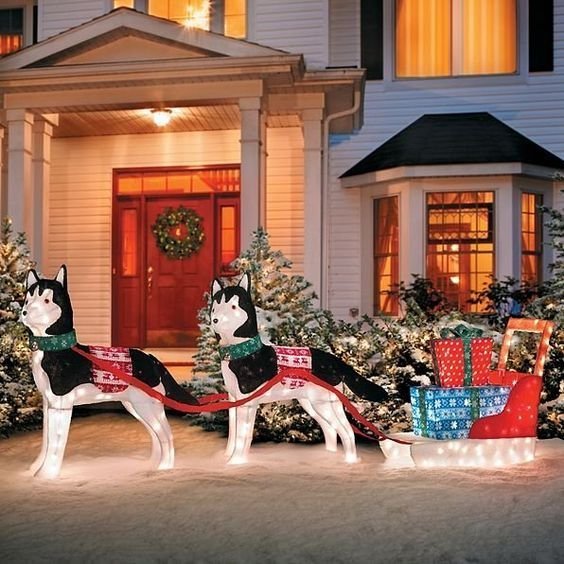 Sled dogs and gifts Christmas garden decoration