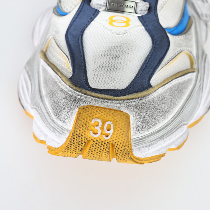 Balenciaga Cargo sneakers in a worn-out white, grey, orange, and blue