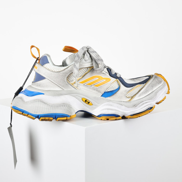 Balenciaga Cargo sneakers in a worn-out white, grey, orange, and blue