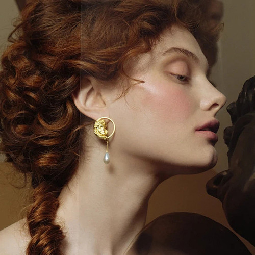 European and American pearl earrings female S925 sterling silver needle retro ear studs hollow portrait metal earrings ins earrings