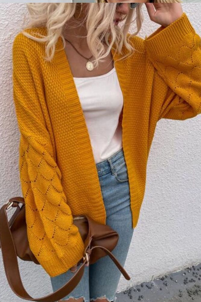 2021 autumn and winter new European and American V-neck cardigan solid color mid-length hollow sweater women