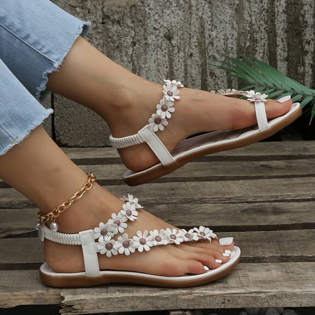 White Elegant Floral Flat Sandals - Women's Strappy Elastic Toe-Loop Slip-On Summer Shoes with Braided Straps and PU Cover Sole
