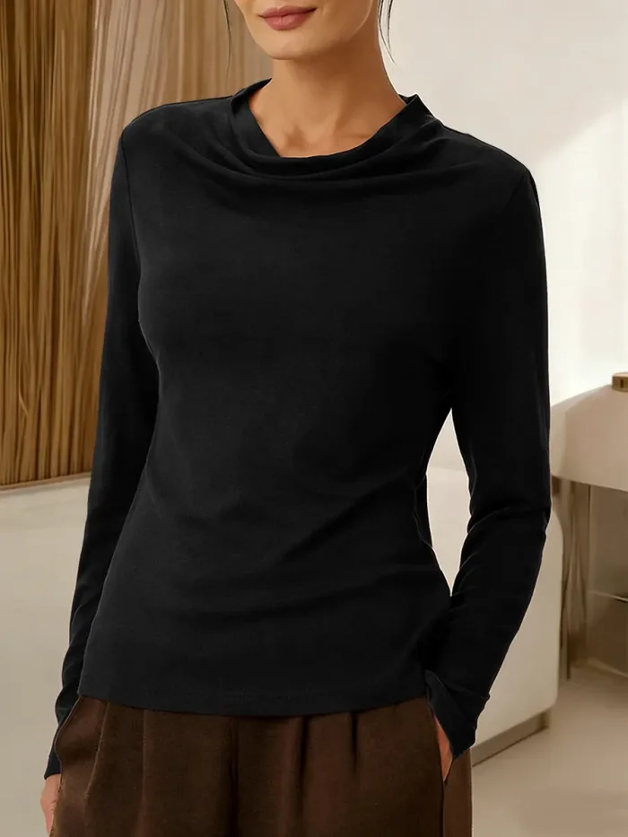 Women's solid color long-sleeved casual top with a draped neckline