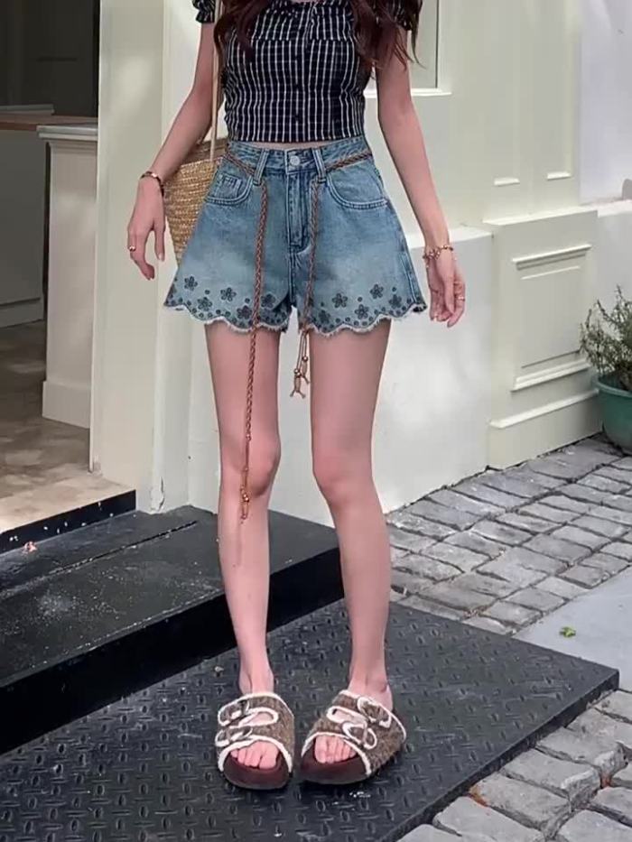 ✨ Light blue vintage denim shorts, bohemian floral embroidery, frayed hem, loose wide fit for summer casual wear.