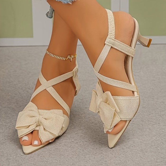 Summer Stiletto Open-Toe Pointed Sandals with a Cross Strap Design And Bow, Creating a Slim And Tall Appearance. They Have a Minimalist And High-End Feel, Making Them Versatile for Any Outfit, Suitable for Dates, Parties, Commuting, And Shopping.