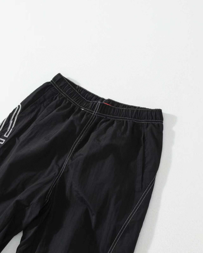 Supreme 25 SPELLOUT EMBROIDERED TRACK PANT FZKZ1723