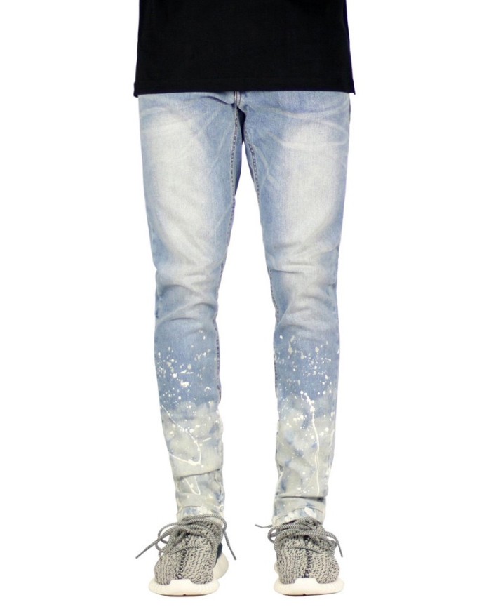 Slim jeans with paint and ink at the bottom