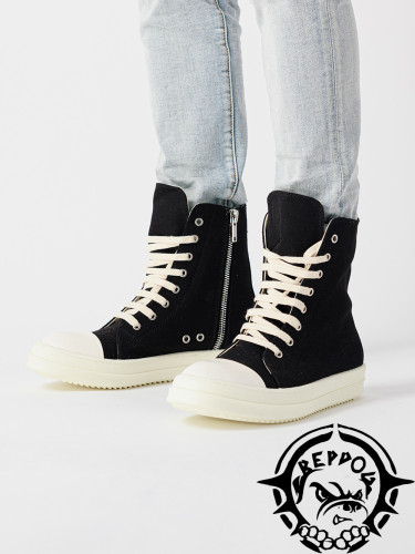High top canvas shoes with a thick sole and lettered heel