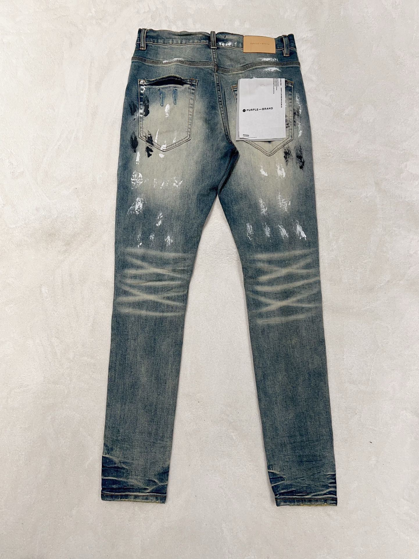 1:1 quality version white and black ink dot ripped patch jeans