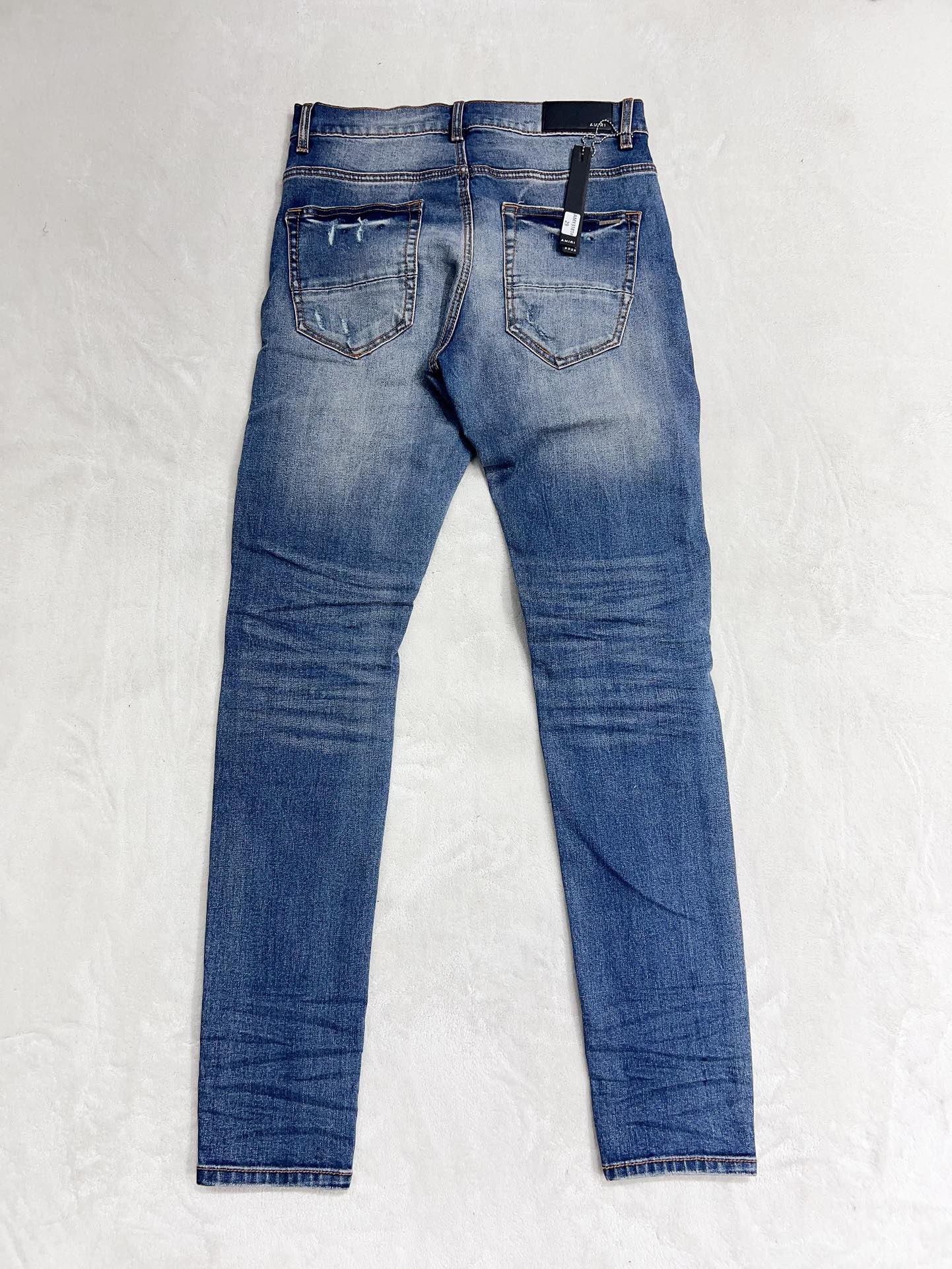 1:1 quality version washed and distressed patchwork jeans