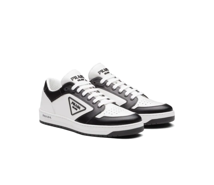 Designer Leather Sneakers High-Top Sneakers Are Accented With Different Interpretations Of The Designer Logo That Appears On The Tongue Along The Light Rubber Sole And As a Rubber Triangle Decorating The Side Of The Ankle