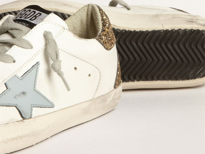 GOLDEN GOOSE Super-Star sneakers with light blue leather star and gold glitter crocodile-print heel tab