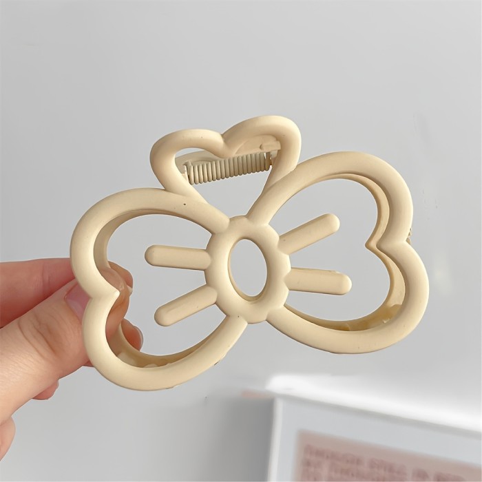 1pc Cute Simple Hollow Bow Hair Clip, Temperament Solid Color Claw Clip, Teens Hair Accessories