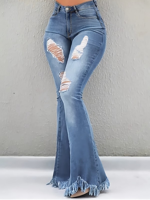 The Distressed White Jeans Feature Flared Legs with Frayed Edges And Heavy Craftsmanship.