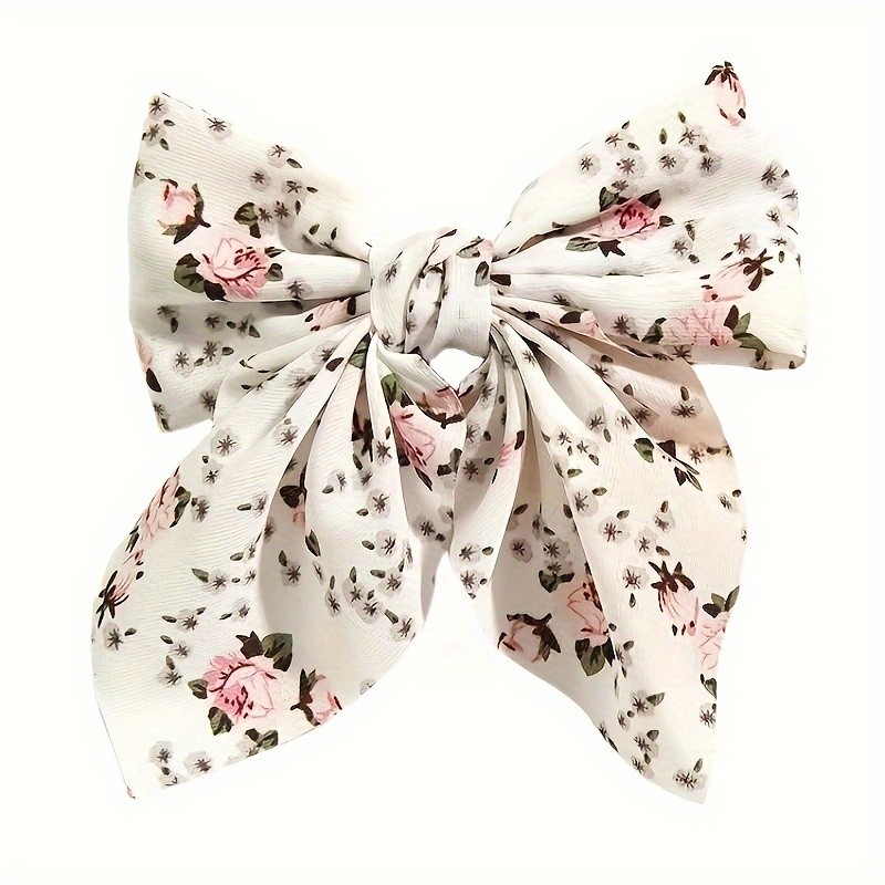 A Multi-Colored Faux Duckbill Clip with a Floral Bow, Perfect for Everyday Wear And Dates.