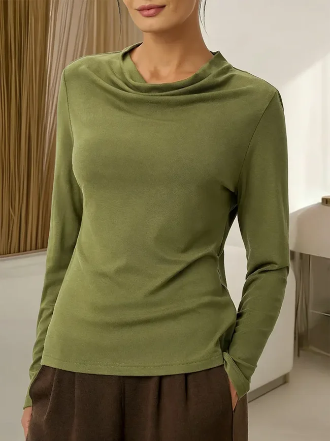 Women's solid color long-sleeved casual top with a draped neckline