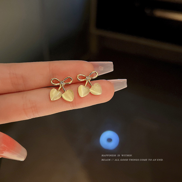 2pcs Hollow Bow Heart Cat Eye Stone Stud Earrings