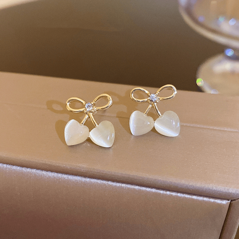 2pcs Hollow Bow Heart Cat Eye Stone Stud Earrings