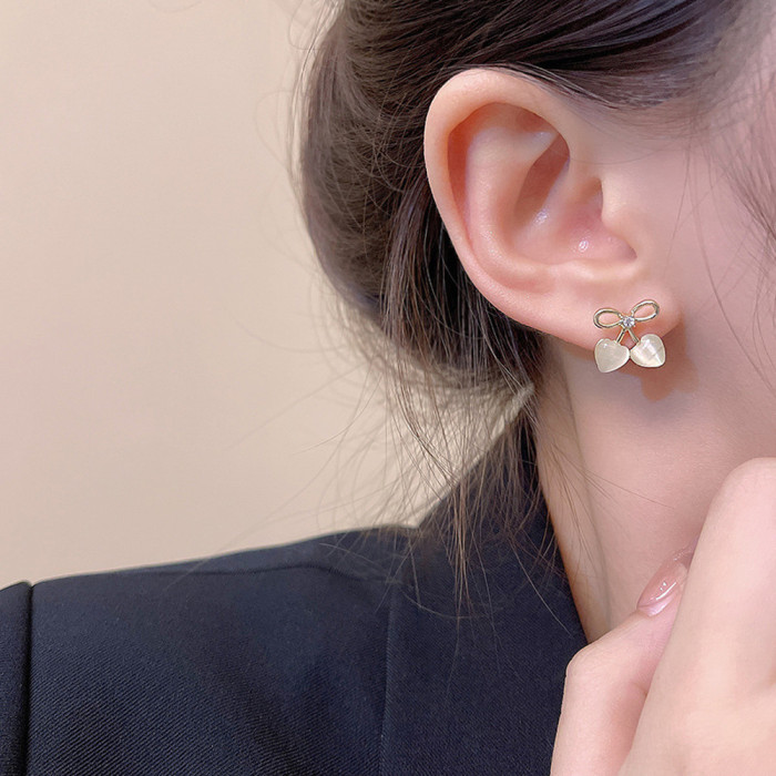 2pcs Hollow Bow Heart Cat Eye Stone Stud Earrings