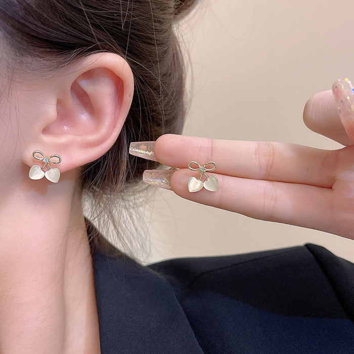 2pcs Hollow Bow Heart Cat Eye Stone Stud Earrings