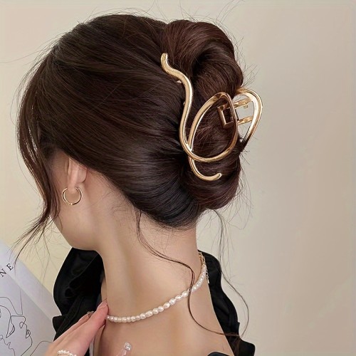 Golden Hair Claw With Hollow Minimalist Golden Hair Claw With Hollow Design, Resembling A Shark Fin Hair Clip