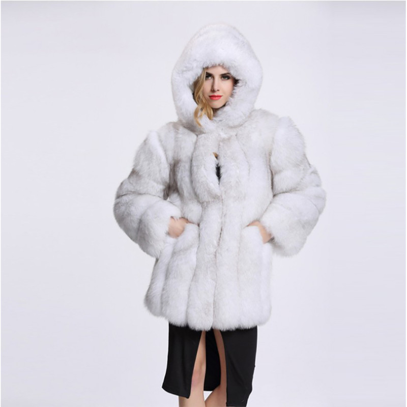 Winter fashionable and warm fur coat mid-length with a patchwork design, faux fox fur and faux fur coat