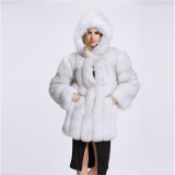 Winter fashionable and warm fur coat mid-length with a patchwork design, faux fox fur and faux fur coat