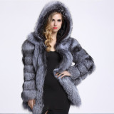 Winter fashionable and warm fur coat mid-length with a patchwork design, faux fox fur and faux fur coat