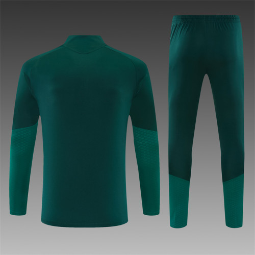26/27 Real Madrid children's training uniform in dark green and rose red