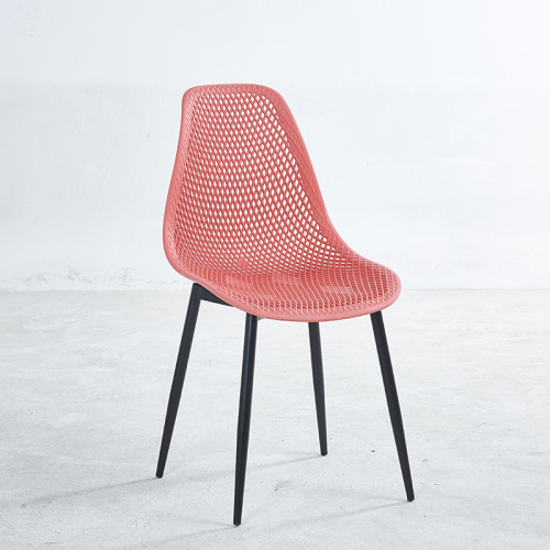 Red plastic dining chair with black painted metal legs
