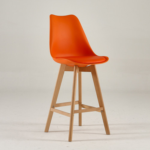 Orange plastic counter stool with footrest