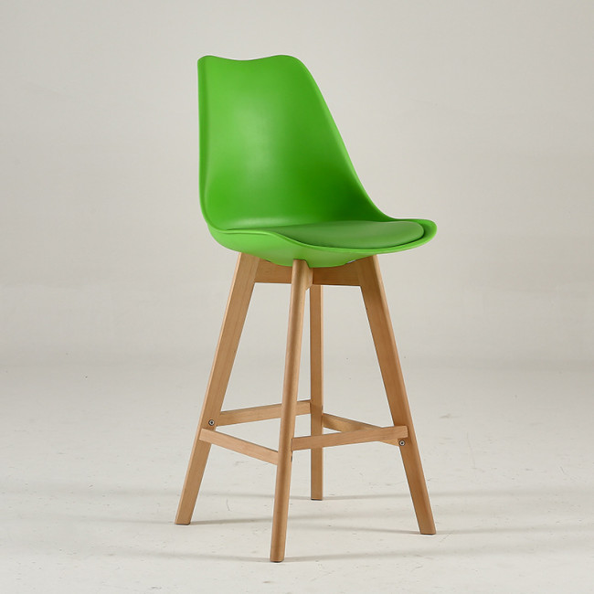 Green plastic counter stool with footrest