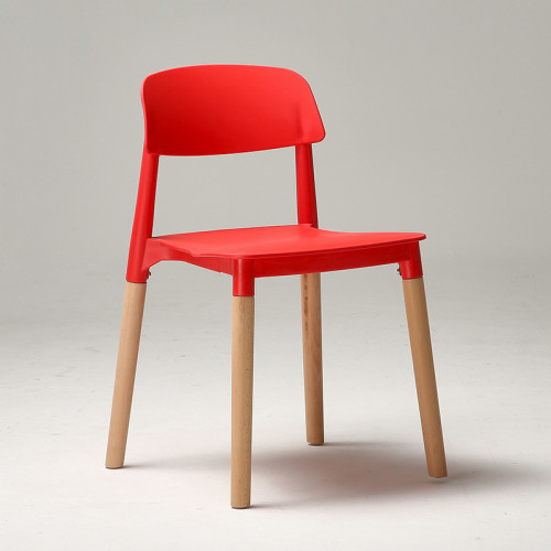 Modern designer red plastic chair with wood legs
