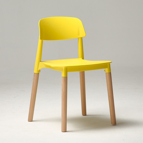 Modern designer yellow plastic chair with wood legs