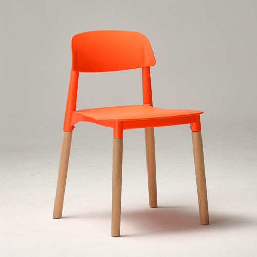 Modern designer orange plastic chair with wood legs
