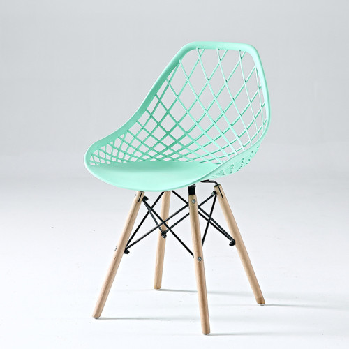 Stylish comfortable light green kitchen chair with eiffel wood legs