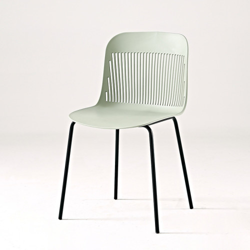 Light green hollow out back plastic chair with metal legs