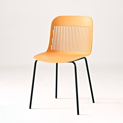 Yellow hollow out back plastic chair with metal legs