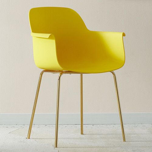 Bright yellow plastic armchair with golden metal legs
