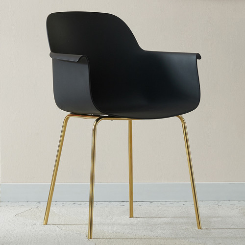 Black plastic armchair with golden metal legs
