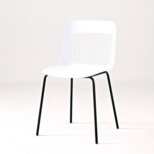 White hollow out back plastic chair with metal legs