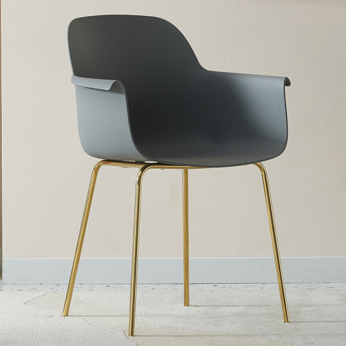 Dark grey plastic armchair with golden metal legs